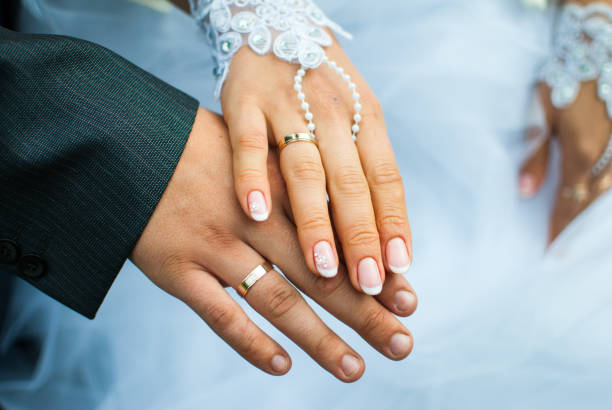 istock Happy bride and groom show off their rings 867172452