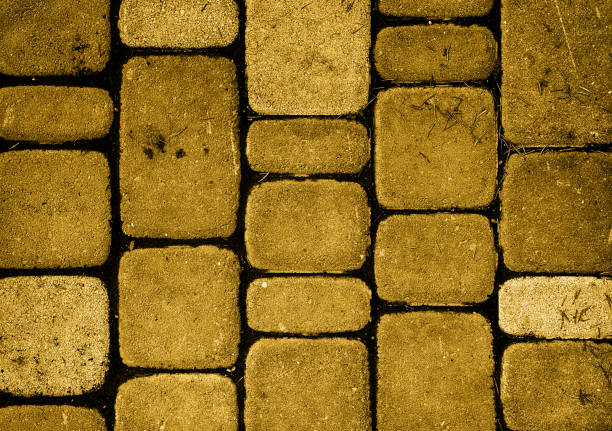 istock Texture of golden stone brick wall 867174998