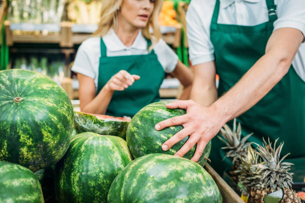 istock shop assistants in supermarket 867176100