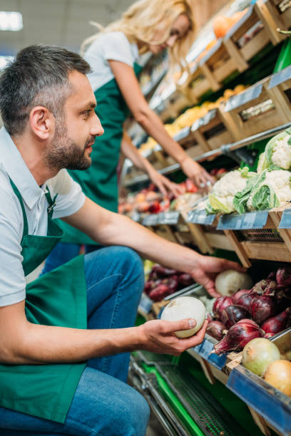 istock shop assistants in supermarket 867176308