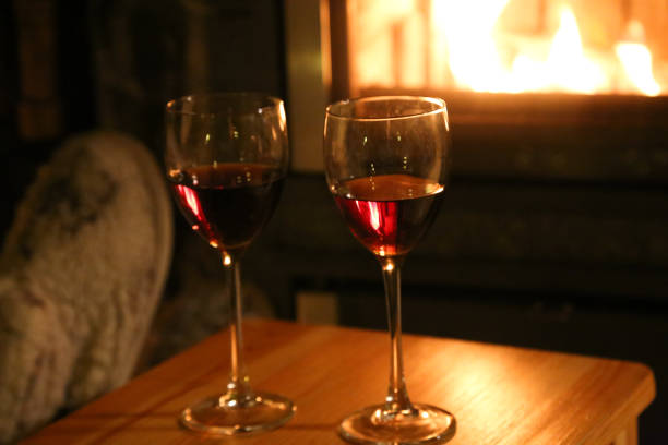 istock Feet in wool socks warming at the fireplace 867176424