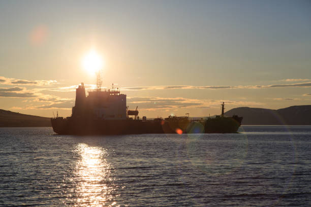 istock Vessel in the sea against a sunset 867182882