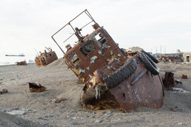 istock Old rusty boat in sand and a pebble 867182884