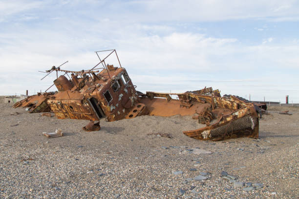 istock Old rusty boat in sand and a pebble 867182898