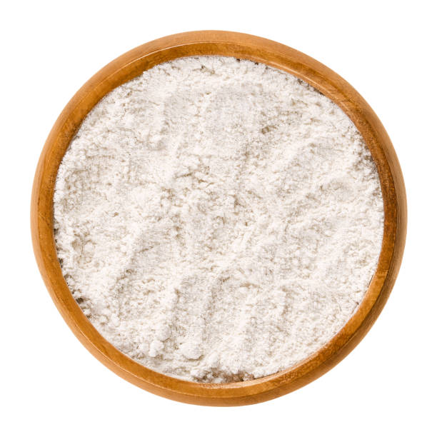 istock Whole wheat flour in wooden bowl over white 867183052