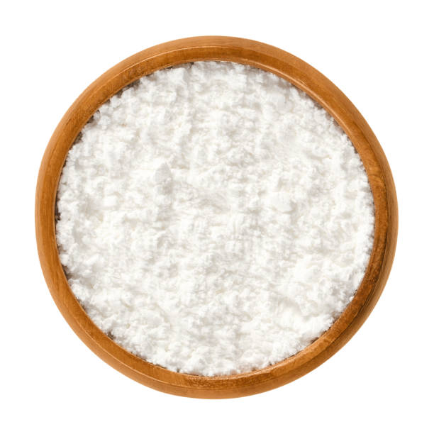 istock Powdered sugar in wooden bowl over white 867183092