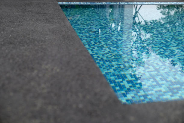 istock water swimming pool with sunny reflections 867183650
