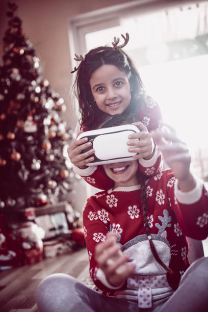 istock Two Little Sisters Playing and Fighting over Virtual Reality Simulator 867195600