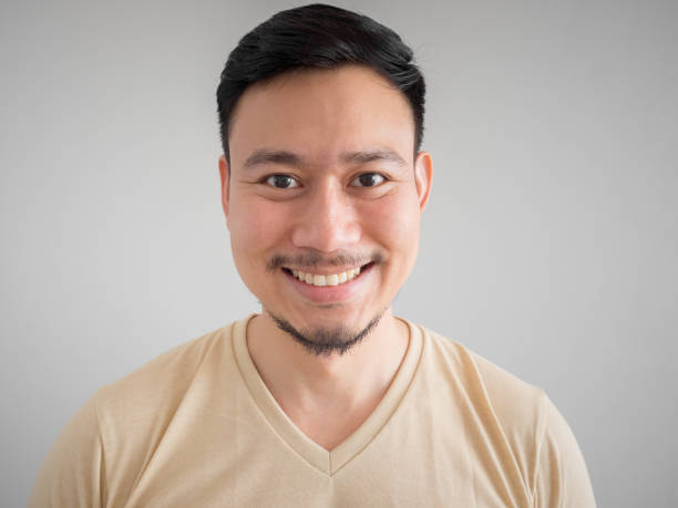 istock Headshot of happy Asian man. 867197022