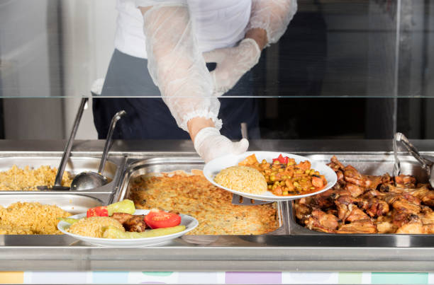 istock chef standing behind full lunch service station 867199408
