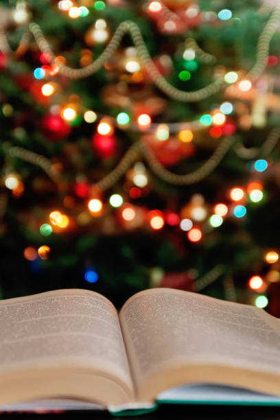 istock Christmas and bible with blurred candles light background 867206610