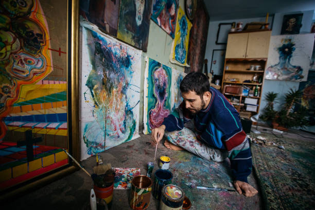 istock Artist man painting alone 867210238