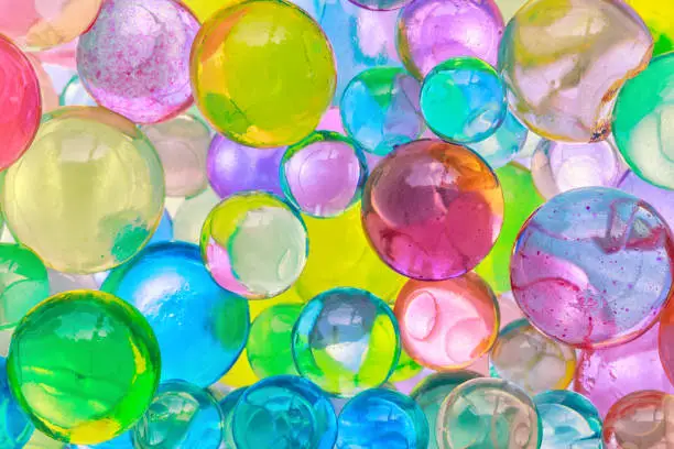 Colorful  Orbeez, color balls, colored polymer gel, hydrogel beads background, close up
