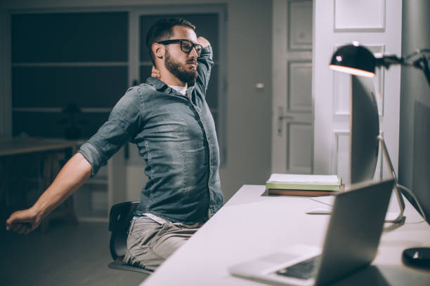istock Tired businessman working late 867220058