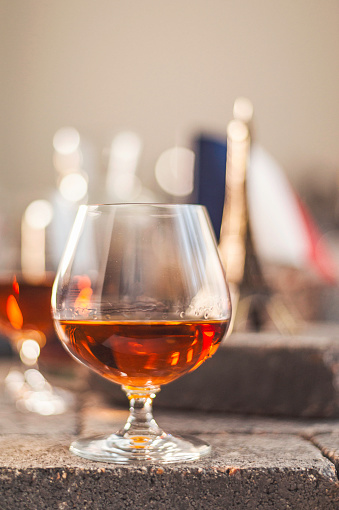 French cognac in glass with French elements