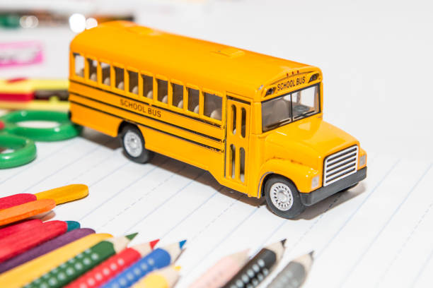 istock Yellow school bus toy vehicle 867228572