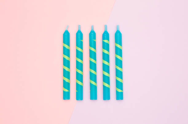 istock Birthday Candles on a Pink and Purple Background 867231680