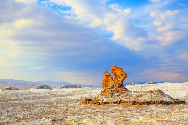 Three Maria’s rock formations also known as Los Vigilantes (the Watchers) - Atacama Desert Moon valley with White salt – moon and Death Valley – above dramatic ethereal pastel colored moon surface landscape at gold colored sunset, exotic volcanoes and Idyllic Atacama Desert, Volcanic landscape panorama – Chile, Bolivia and Argentina border escultura formación roca los vigilantes (watchers) - valle de la luna del desierto de atacama con sal blanca, la luna y valle de la muerte – luna dramática superficie paisaje oro coloreado puesta de sol, desierto de atacama idílico panorama de paisaje volcánico – chile