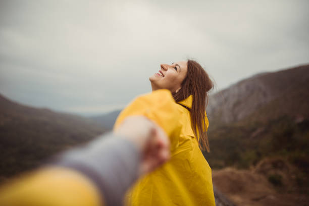 istock Hikers holding hands in nature 867235136