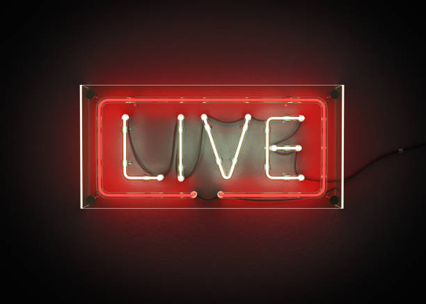 istock Live sign made from neon alphabet on a black background. 867238424
