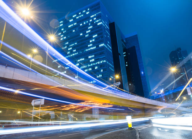 istock traffic trails in downtown hong kong 867239584
