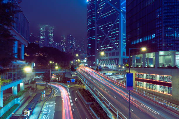 istock traffic trails in downtown hong kong 867239586