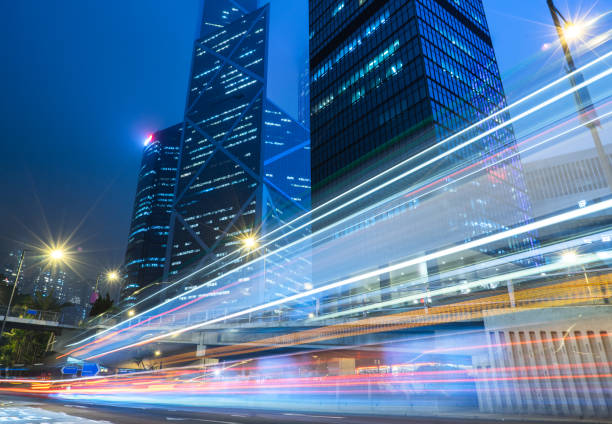 istock traffic trails in downtown hong kong 867241784