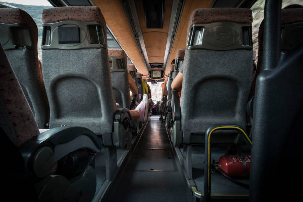 istock Bus central corridor perspective from the back of the car 867244838