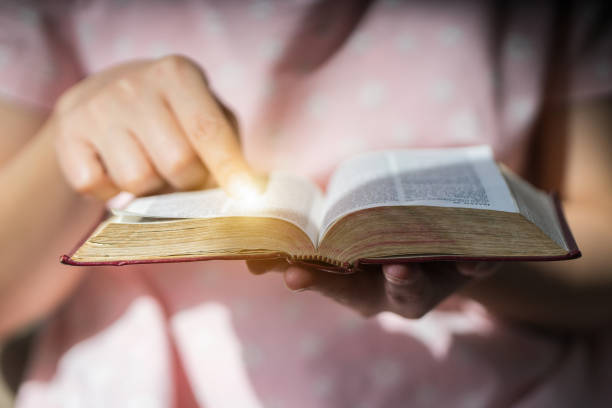 istock Women  Reading Holy bible. 867248110