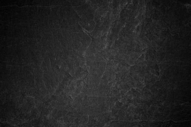 istock Dark grey black slate background or natural stone texture. 867255830