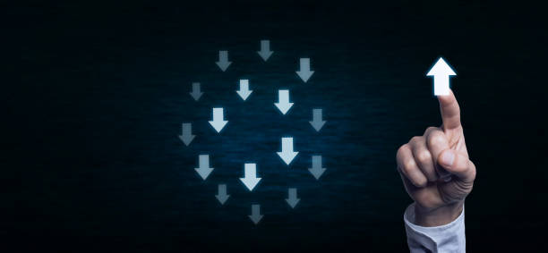 istock Hand pushing arrow sign in opposite direction from others. Difference thinking concept. 867260686