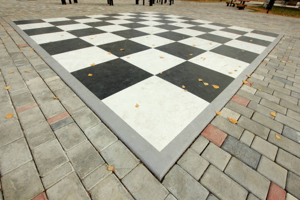istock chess board on the pavement in the park 867263638