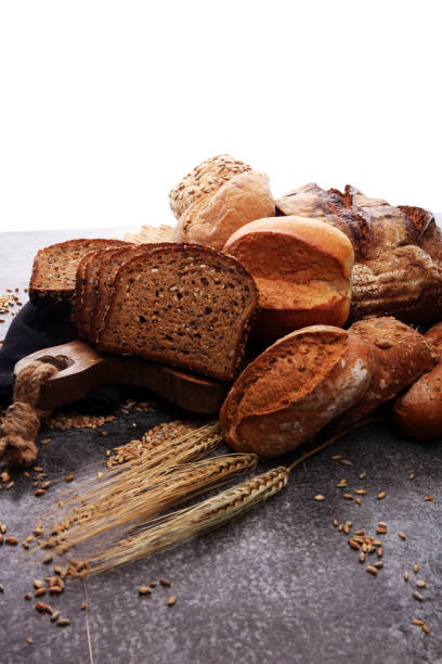 istock Sliced rye bread on cutting board. Whole grain rye bread with seeds. 867264544