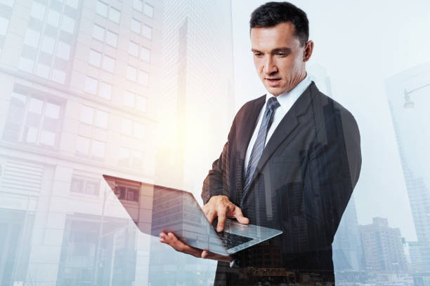 istock Pleasant handsome man looking at the laptop screen 867274030