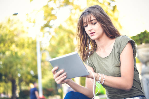 istock Young female  student learning in the city,autumn time. 867276288