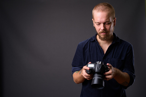 Studio Portrait Of Finnish Man Against Gray Background