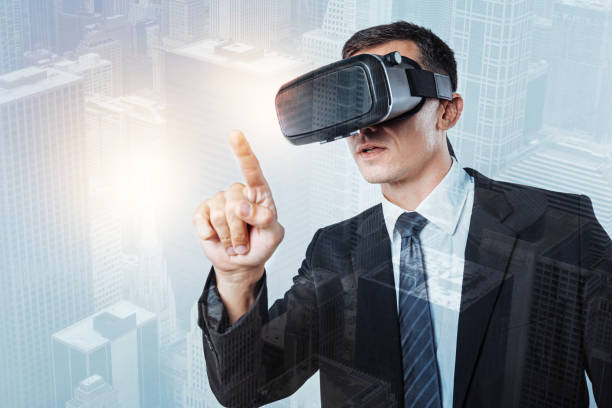 istock Serious nice man pressing his finger to the sensory screen 867280108