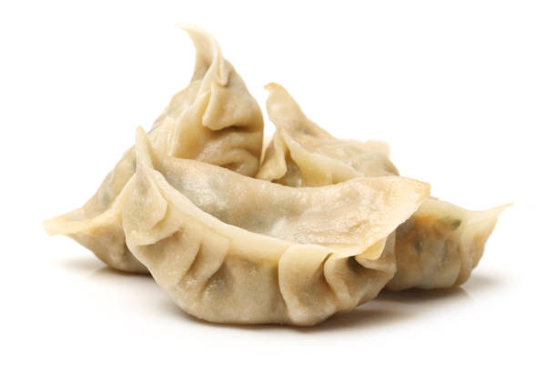 Dumplings in a white background Dumplings in a white background chinese dumpling stock pictures, royalty-free photos & images