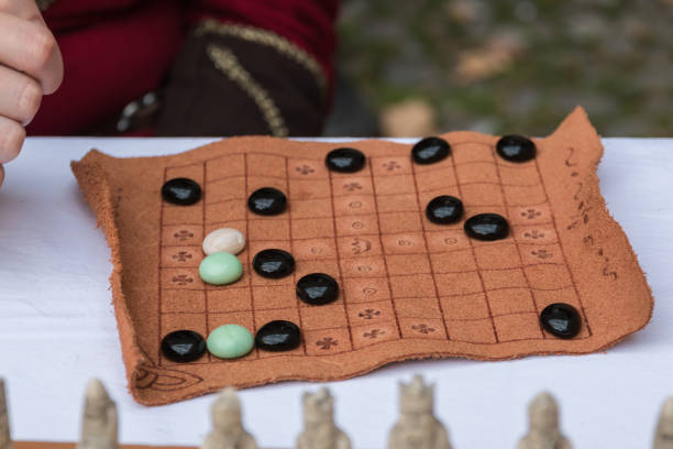 istock Antique Table Game with Oval Pieces and Brown Fabric Board 867287568