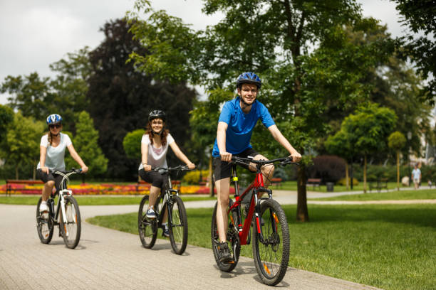 istock Urban biking- three people riding bikes in city 867290888