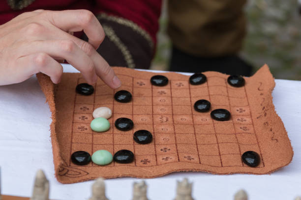 istock Antique Table Game with Oval Pieces and Brown Fabric Board 867297818