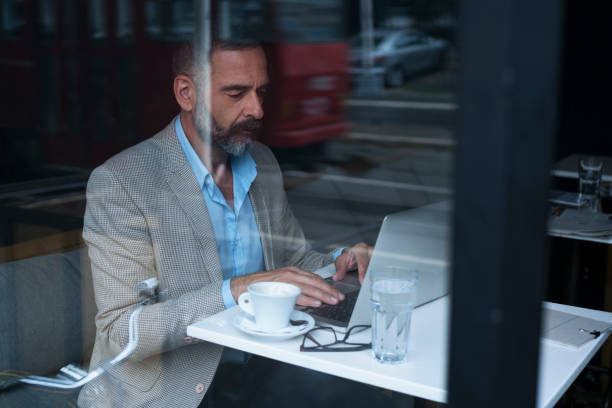 istock Dedicated Businessman Working At Cafe 867298856
