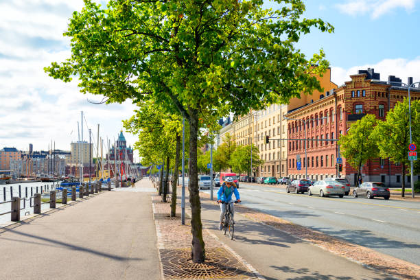 Helsinki, Finland - August 24, 2017: Summer panorama from north harbour of Helsinki in summer. Street view with architectures, ships yachts and boats at the old town of Helsinki. Famous Uspensky Cathedral can be seen on the left side. It is a popular tourist destination.