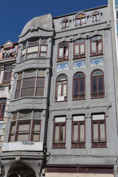 istock Typical Antique Portuguese Architecture: Grey Facade with Old Wi 867304538