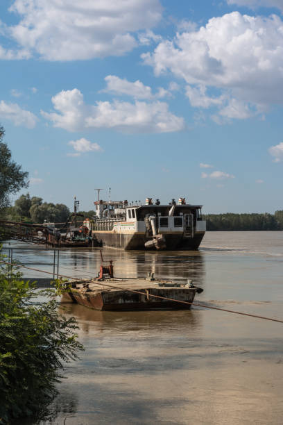 istock Abandoned Boat in River In Italy with Cloud Sky 867305650
