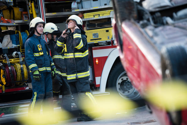 istock Female firefighter at a car accident scene 867314594