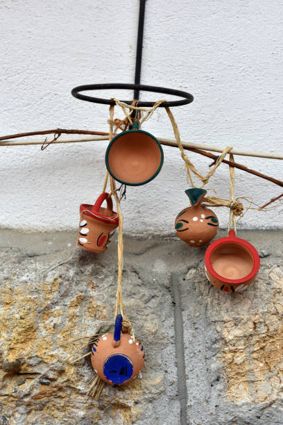istock Hanging clay jugs and cups on the wall 867315466