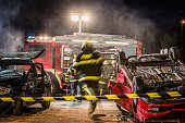 Firefigters at a car accident scene