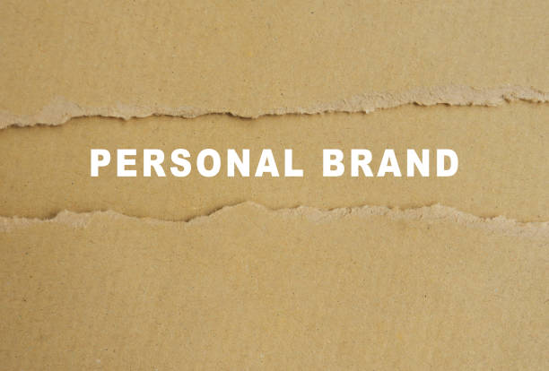 Personal brand words on torn brown paper