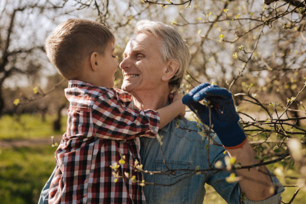 istock Delighted grandfather looking at his grandson 867342066